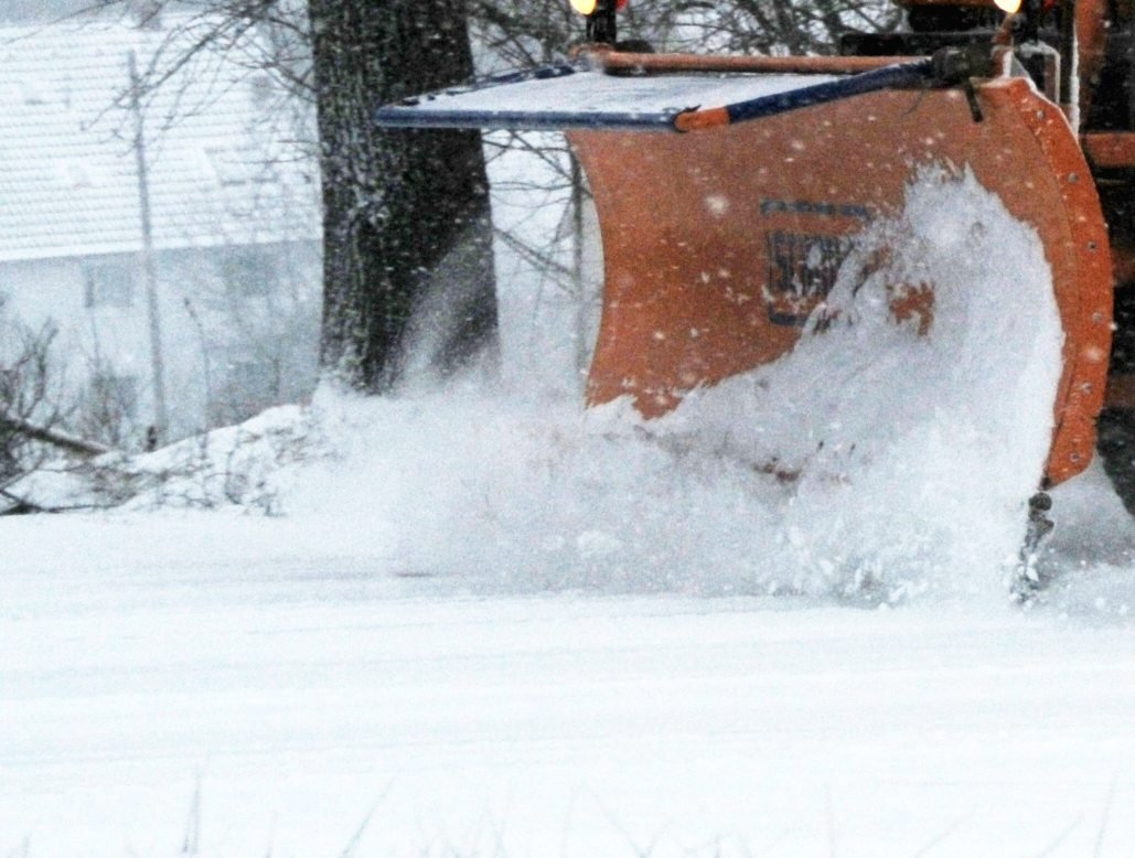 Plow blade clearing deep snow